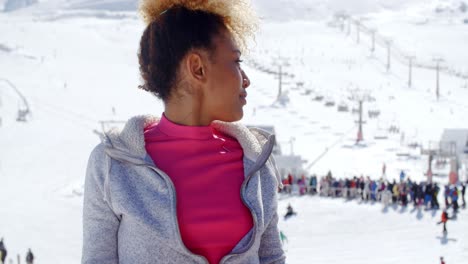 Trendy-young-woman-at-an-alpine-ski-resort