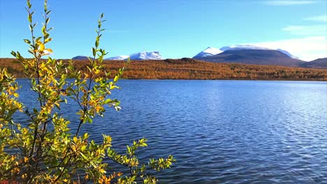 scenic mountain lake on a crisp clear autumn day in abisko national park in lapland, sweden - timelapse