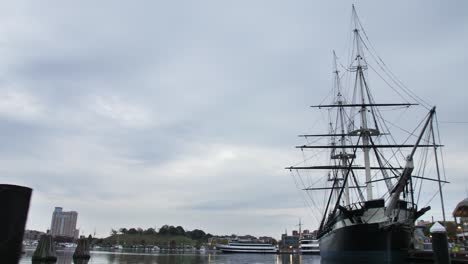 wooden colonial ship docked at harbor 4k