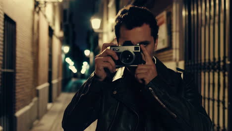 photographer in a night alley