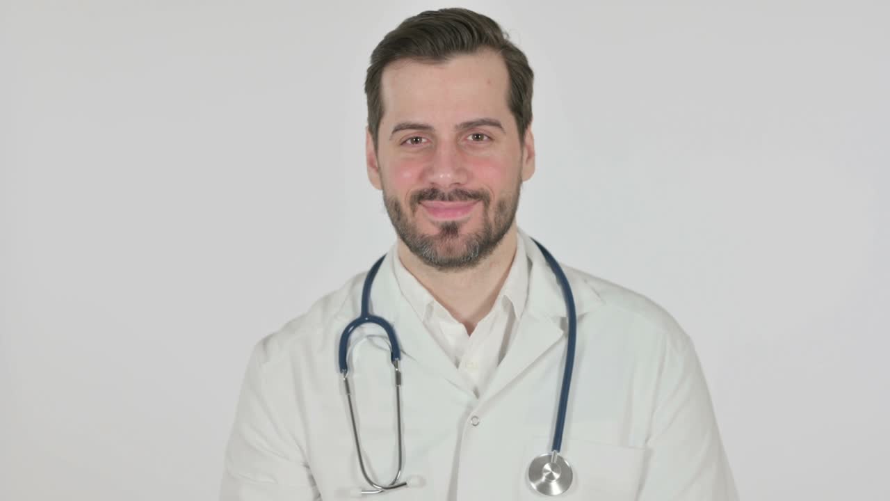 Portrait of Doctor Shaking Head as Yes Sign, White Screen