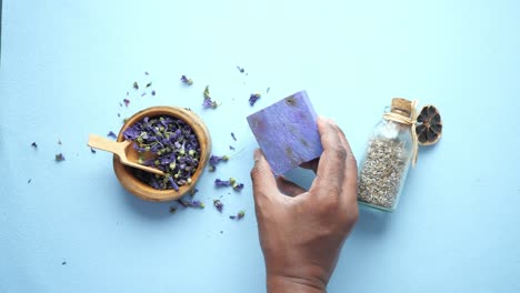 purple herbal soap with dried flowers and lavender