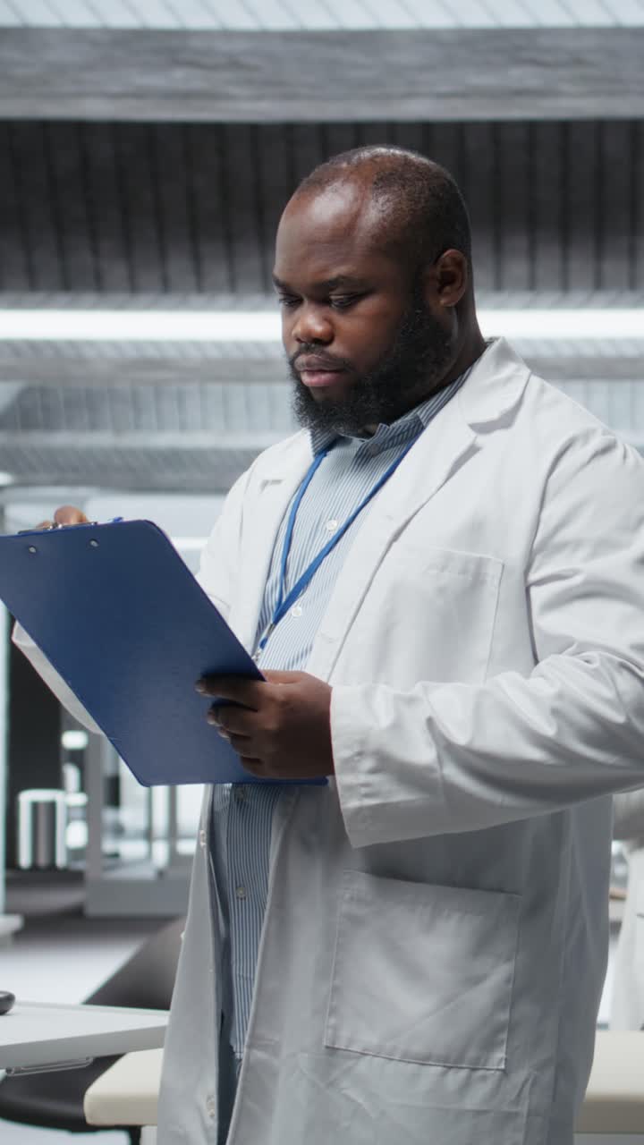 Vertical Video Black doctor conducts clinical trial in a research lab and observing patient