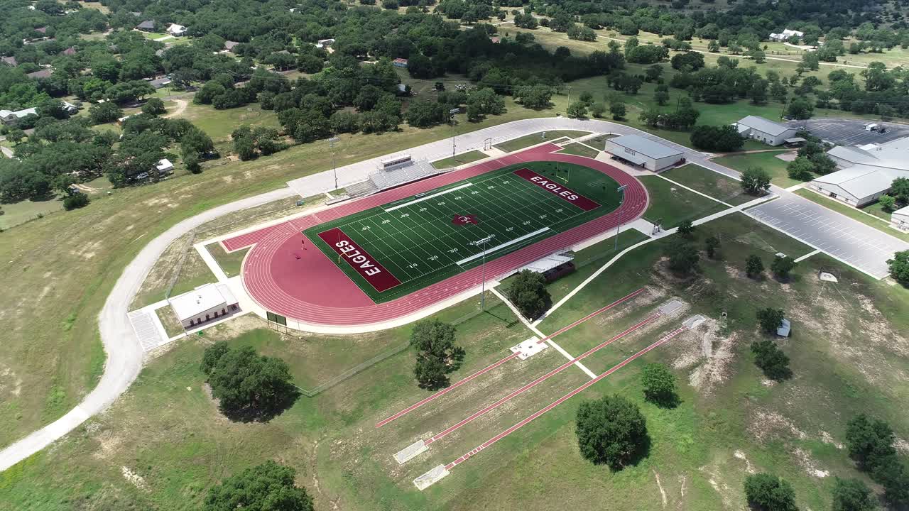 Aerial View of a High School Football Field and Running Track