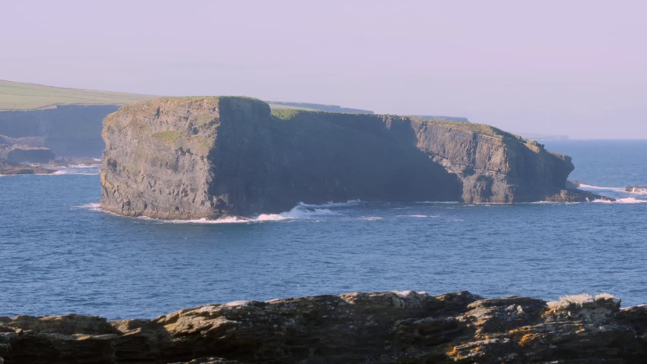 Timelapse zoom-in of Illaunonearaun Island on a sunny day, perfect for an opening shot