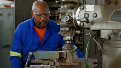 metalsmith working in workshop 4k