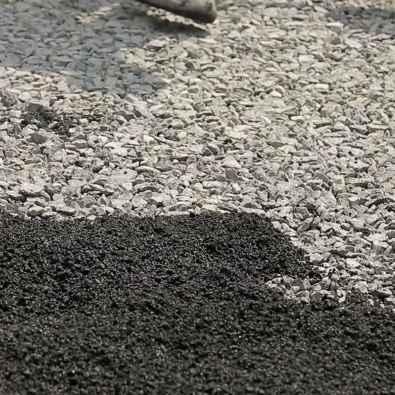 Workers Making Asphalt Road