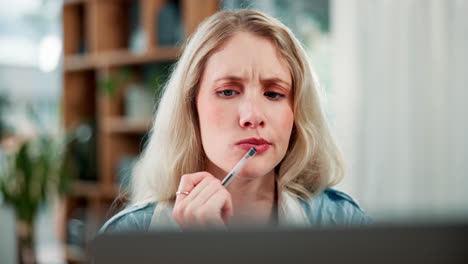 a woman thinking with a pen in her hand