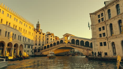 golden sunset over venice's rialto bridge