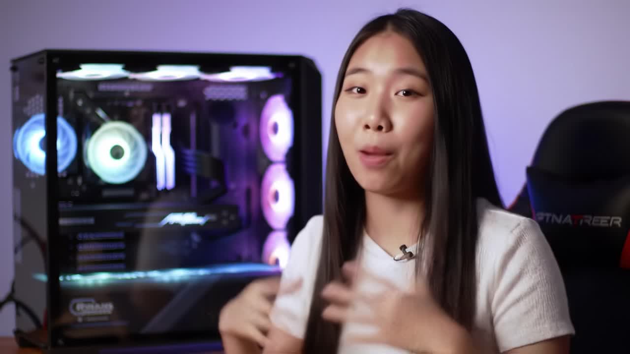 Engaging Presentation on Gaming PC Build Techniques with Enthusiast Explaining Customization and Performance Insights in Front of an RGB-Cooled Setup