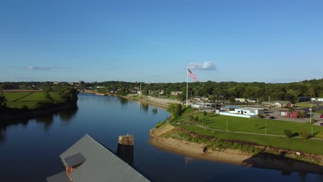freedom point at liberty park and cumberland river in clarksville, tennessee towards us flag. aerial