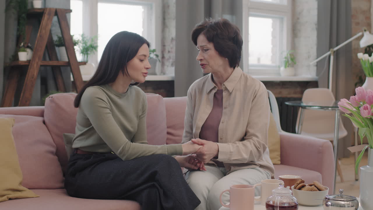 Mother and daughter talking at home