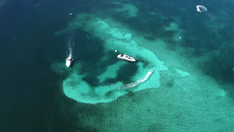 luxurious motorboat yachts cruising in tropical caribbean sea waters