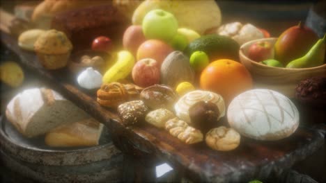 food table with wine barrels and some fruits, vegetables and bread