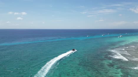 aerial shot of a speedboat on the beach of bayahibe in dominican republic