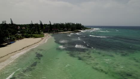 Amazing-slow-pan-drone-tropical-shot-of-blue-sky-turquoise-waves-in-water-in-st