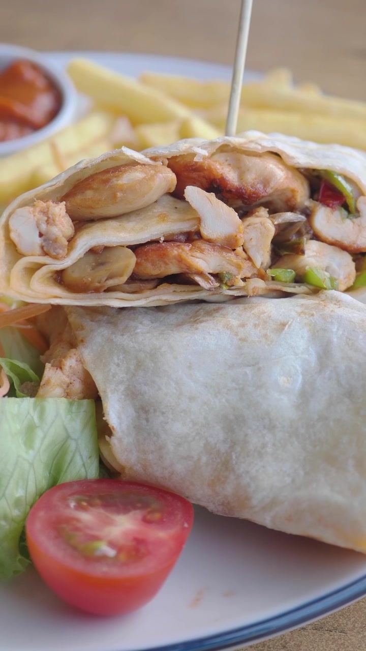 Appetizing Chicken Wrap Served with Crispy Fries and Side Salad