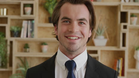 handsome young business man portrait of sales person wearing suit smiling happy enjoying successful lifestyle
