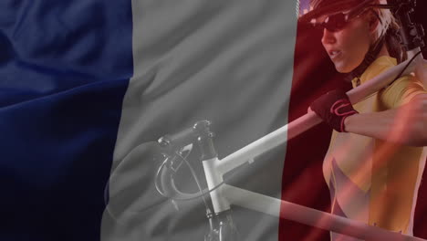 animation of flag of france over caucasian female cyclist