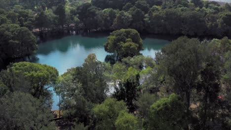 AERIAL:-Lago-De-Camecuaro,-Boat,-Tangancicuaro,-Mexico