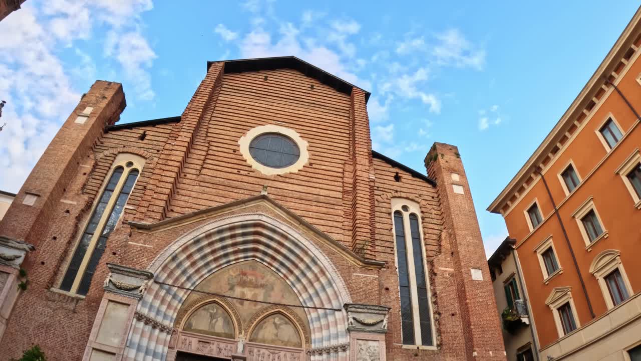 Ground-level shot showing Gothic façade of Santa Anastasia Basilica, Verona.
