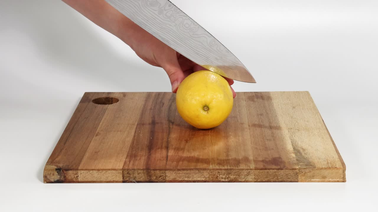 Sequence of cutting a lemon with a knife