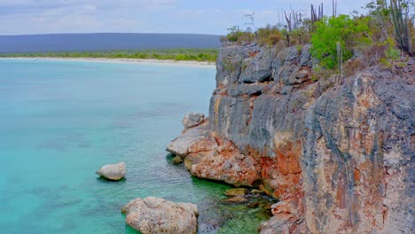 drone view of rock en bahia de las aguilas o eagles bay en república dominicana