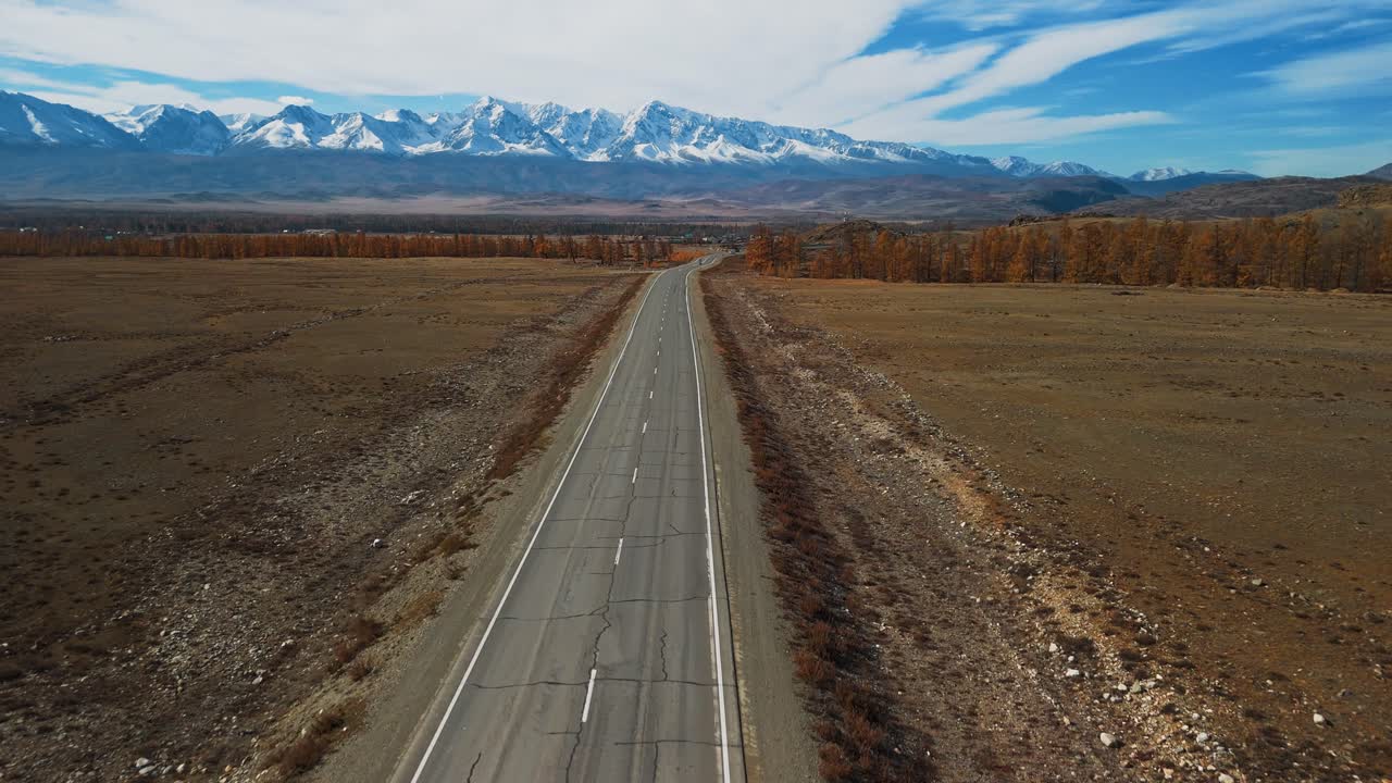 Empty Road through Scenic Autumn Mountain Landscape
