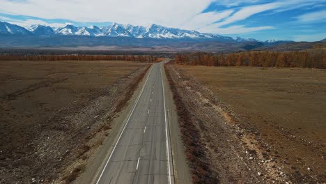 empty road through scenic autumn mountain landscape