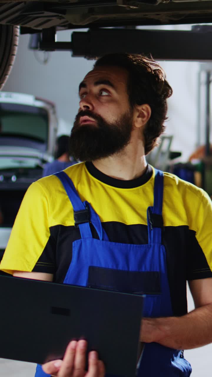 Vertical video Repairman looks online for new car parts