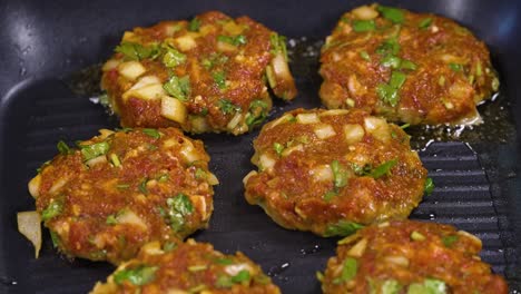 frying lamb beef burger paddies kebab in pan, adana kebab paddies, lebanese kebbeh, turkish kebab, pan fried