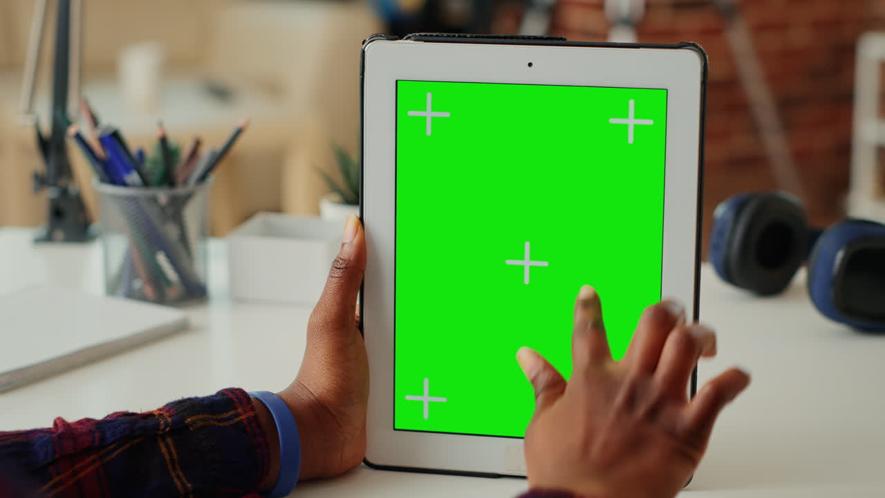 African american woman vertically holding isolated greenscreen