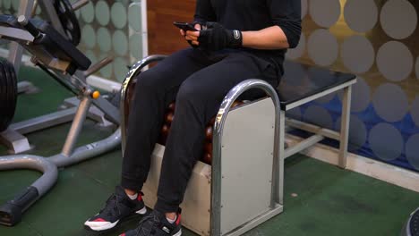massaging legs on roller machine after legs workout