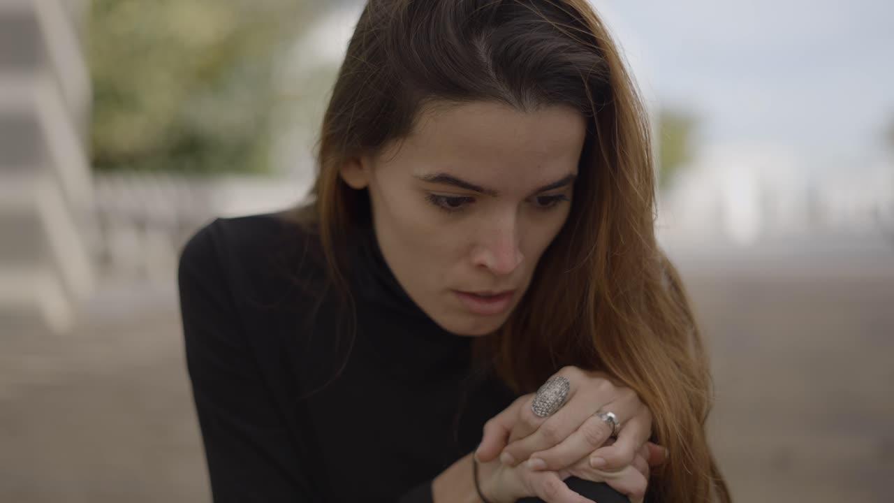 Woman Outdoors in Thoughtful Pose