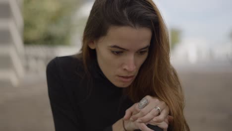 woman outdoors in thoughtful pose