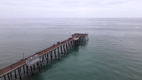 excellent aerial view of the pier in san clemente, california on an overcast day