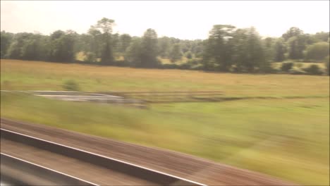 A-passenger-view-of-a-mainline-train-journey-in-England,-United-Kingdom,-from-Retford-to-King's-Cross-Station