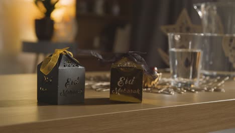 Close-Up-Of-Gift-Boxes-On-Table-In-Muslim-Home-Celebrating-Eid