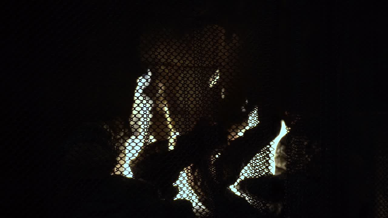 Close up shot of fireplace with pale glow flames burning