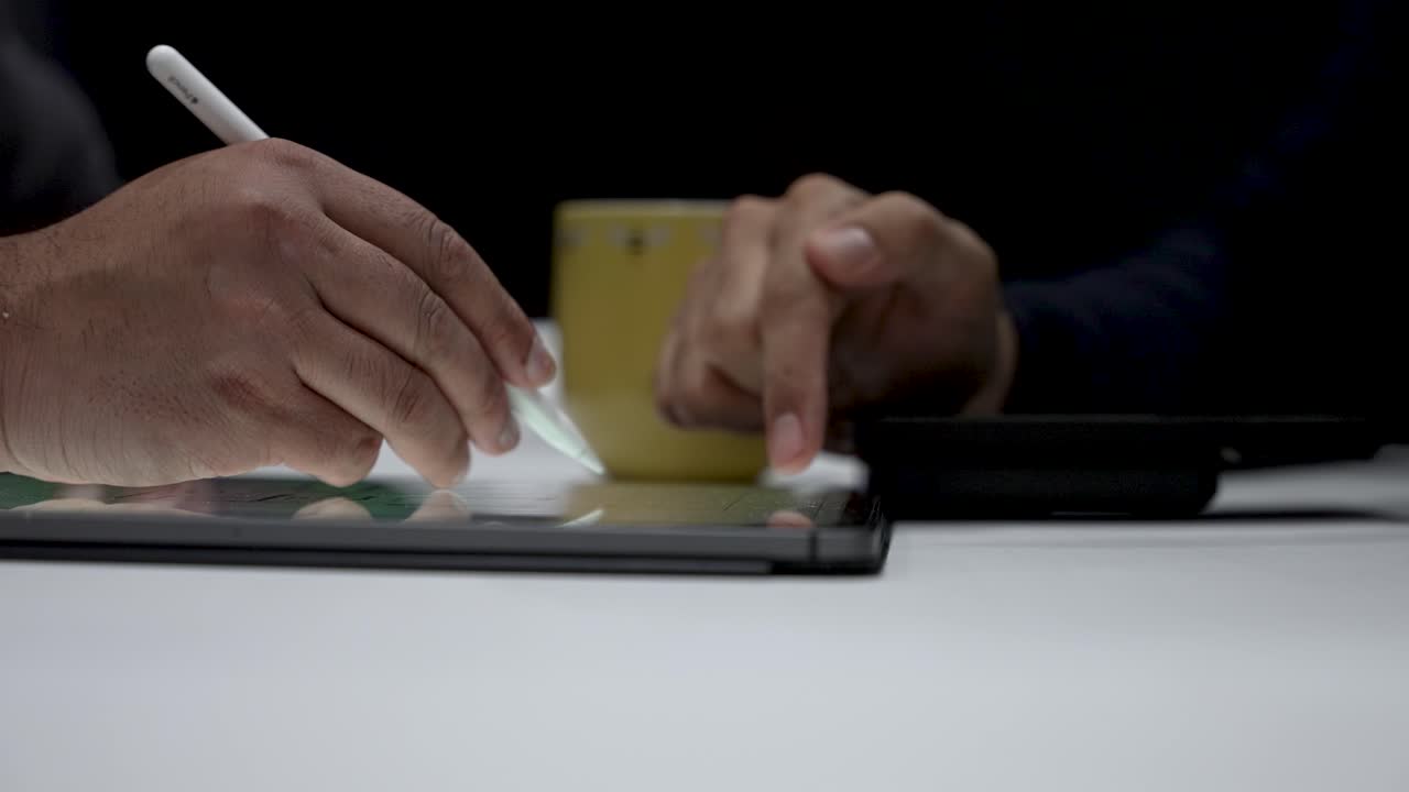 Engineer And Architect brainstorming architectural house plans and collaborate using tablet technology