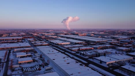 a massive cloud of steam rising from the power plant