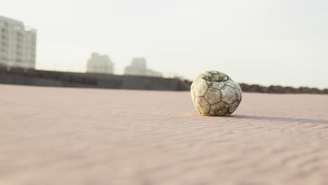 very old soccer ball on the playground
