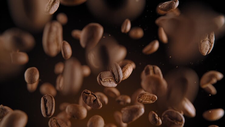 Roasted Coffee Beans Flying And Falling In Macro On A Warm Brown Background, Slow Motion