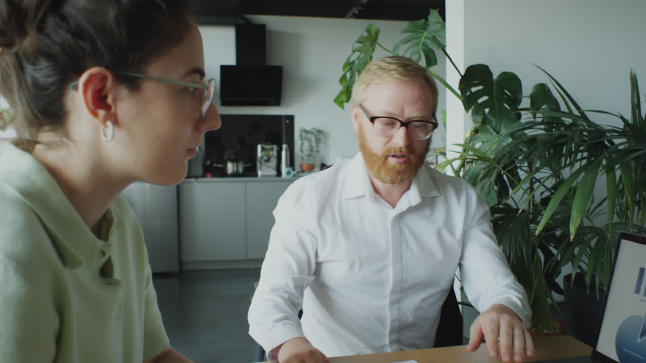 POV of Man and His Wife Talking with Financial Consultant
