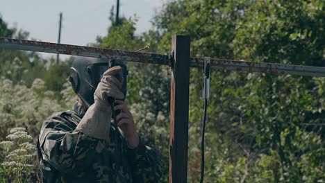 slow motion welder fixes carcass of fence at country house