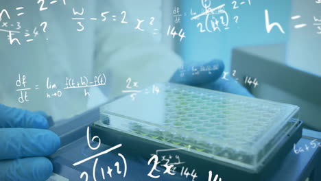 Animation-of-mathematical-equations-over-biracial-male-scientist-working-in-lab