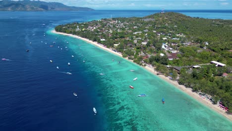 bird eye view of the touristic turquoise water beach of gili trawangan island in indonesia