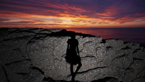 sunset silhouette on coastal rocks