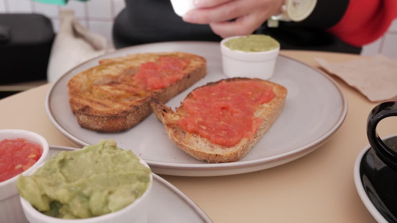 Fresh tomato and avocado spread on toast, cozy café breakfast moment indoors