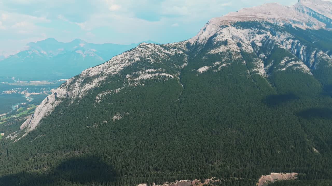 Aerial Revealing shot, Town of Banff, Morning shot. Banff National Park, Alberta, Canada